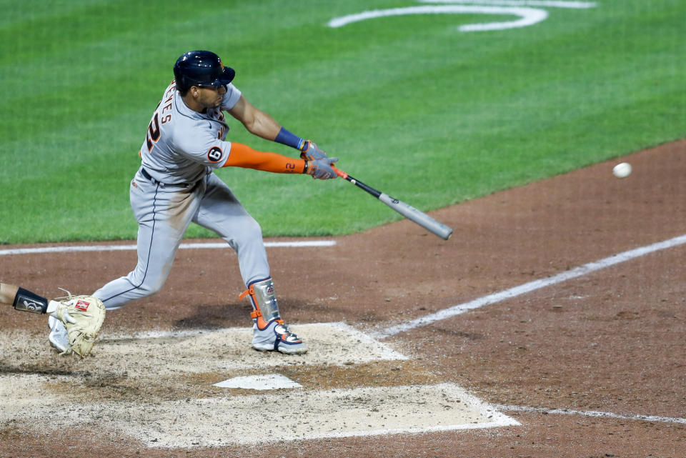 Detroit Tigers' Victor Reyes drives in Travis Demeritte with a hit against the Pittsburgh Pirates in the seventh inning of a baseball game Friday, Aug. 7, 2020, in Pittsburgh. (AP Photo/Keith Srakocic)