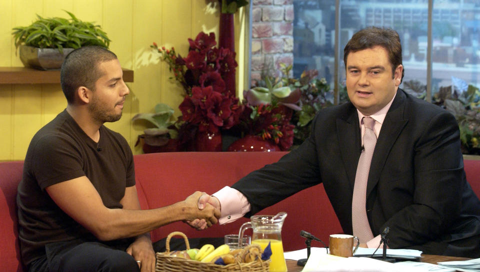 lIlusionist David Blaine is interviewed by GMTV presenters Eamonn Holmes and Fiona Phillips during GMTV's morning show at London TV Centre on the Southbank in London. Blaine had the long-awaited rematch with Eamonn Holmes, two years after their excruciating first interview. During that infamous encounter on GMTV, Holmes squirmed as the magician barely said a word, stared him out and flashed an eye drawn on the palm of his hand. 