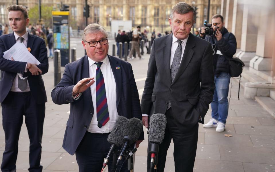 Mark Francois and David Jones from the European Research Group of Tory MPs address the media outside the Houses of Parliament this afternoon