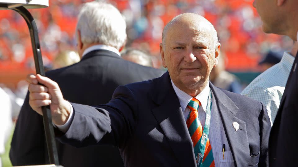 In this 2012 photo, H. Wayne Huizenga stands on the field before an NFL football game between the Miami Dolphins and New York Jets in Miami. - Lynne Sladky/AP