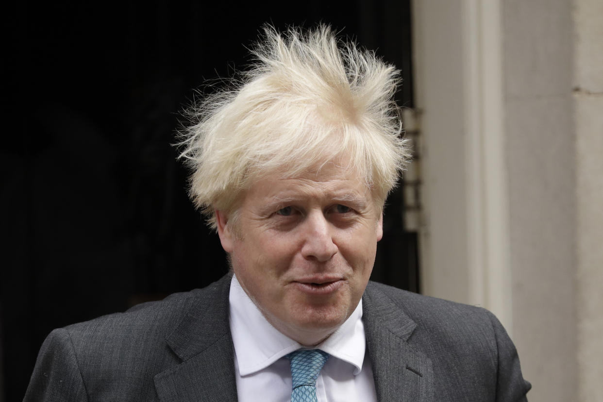 British Prime Minister Boris Johnson leaves 10 Downing Street in London, to attend the weekly Prime Minister's Questions at the Houses of Parliament, in London, Wednesday, Sept. 16, 2020. (AP Photo/Matt Dunham)