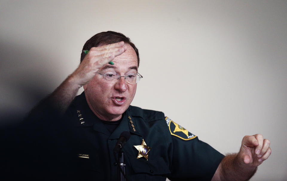 FILE - Sheriff Grady Judd, of Polk County, Fla., speaks during a state commission meeting as they investigate the Marjory Stoneman Douglas High School massacre and how Broward school district and others access threats, on Tuesday, July 10, 2018, in Sunrise, Fla. In 2022, he says, “We’re not going to wait for an Uvalde, Texas, or a Parkland or a Columbine if we have the information and people say that they’re going to shoot or kill. ... We’re going to use the tools that the state gave us.” (AP Photo/Brynn Anderson, File)