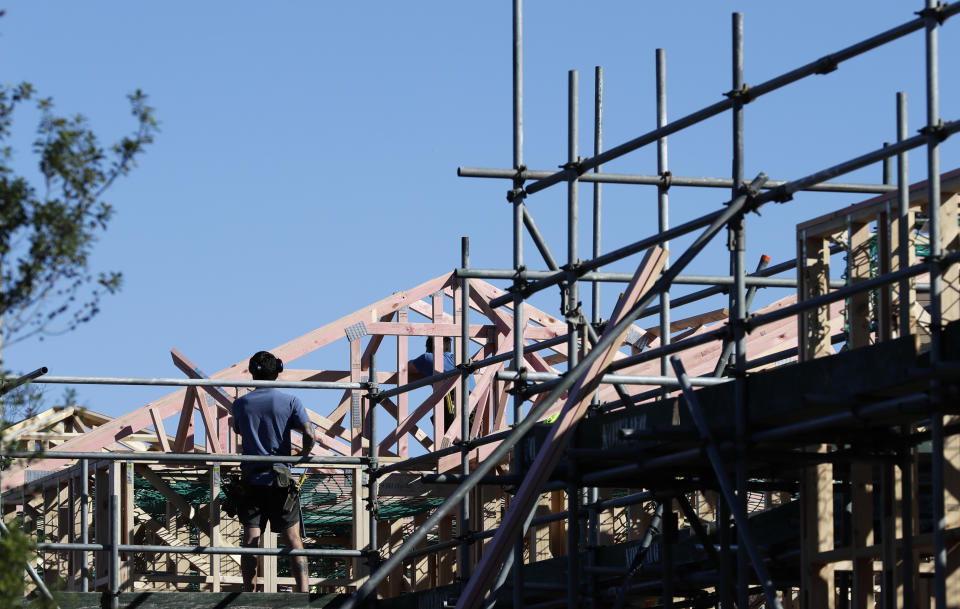 FILE - Builders work on a construction site in Christchurch, New Zealand, April 28, 2020. New Zealand's government introduced sweeping measures to free up land for new homes on Thursday, July 4, 2024, pledging to "flood the market" with opportunities to build houses, and scrap rules for minimum floor areas and balconies in apartments. (AP Photo/Mark Baker, File)