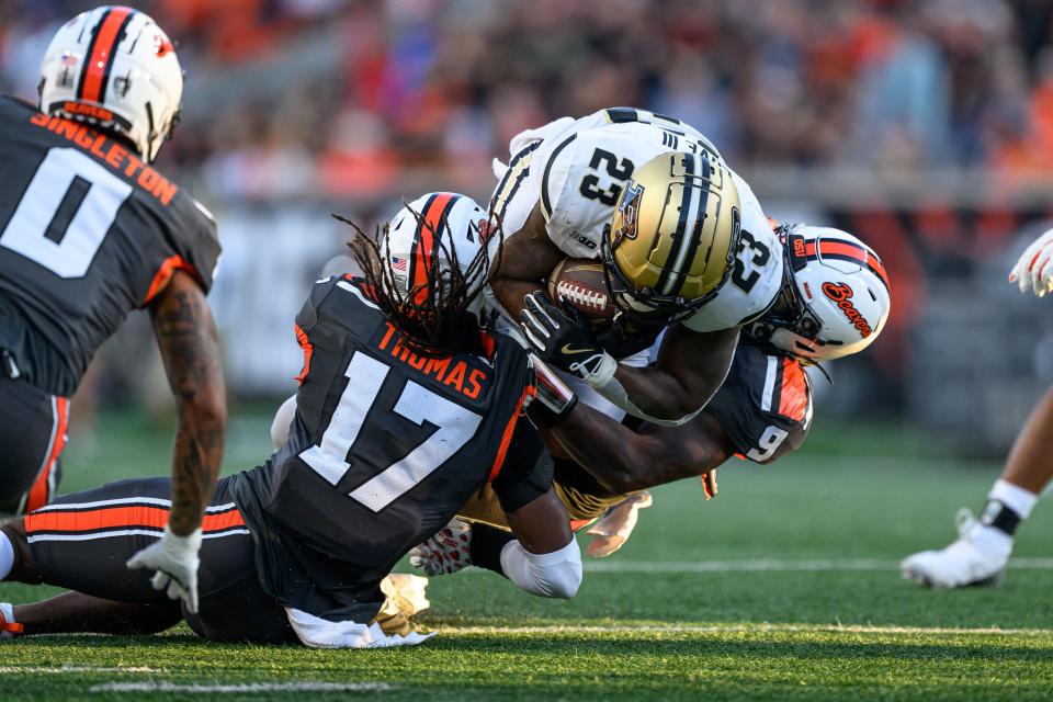 Sep 21, 2024; Corvallis, Oregon, USA; Oregon State Beavers defensive back Skyler Thomas (17) and linebacker Isaiah Chisom (9) stop Purdue Boilermakers running back Reggie Love III (23) on fourth down during the second half at Reser Stadium. Mandatory Credit: Craig Strobeck-Imagn Images