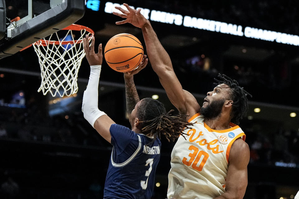 Tennessee guard Josiah-Jordan James (30) blocks a shot by Saint Peter's forward Corey Washington (3) during the first half of a first-round college basketball game in the NCAA Tournament, Thursday, March 21, 2024, in Charlotte, N.C. (AP Photo/Mike Stewart)