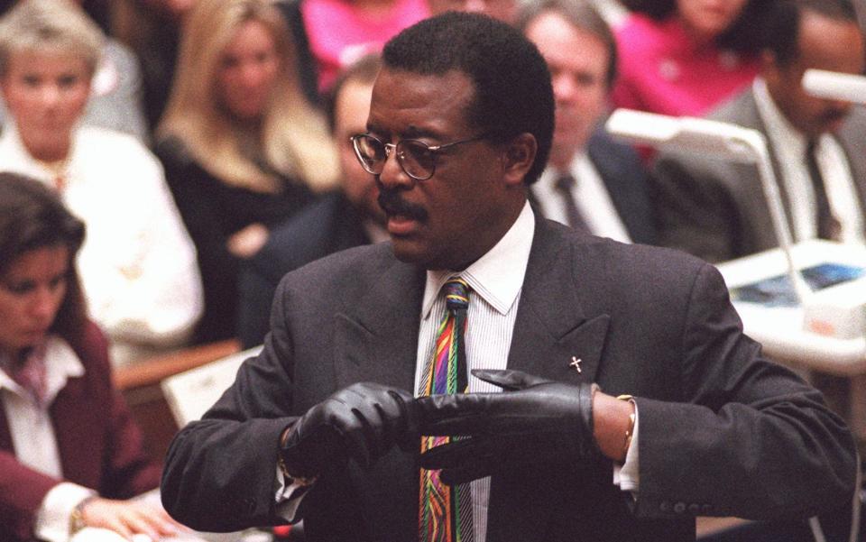 What could be more theatrical than a prop? Johnnie Cochran's infamous 'If it doesn’t fit, you must acquit' glove routine - AP Photo/Vince Bucci