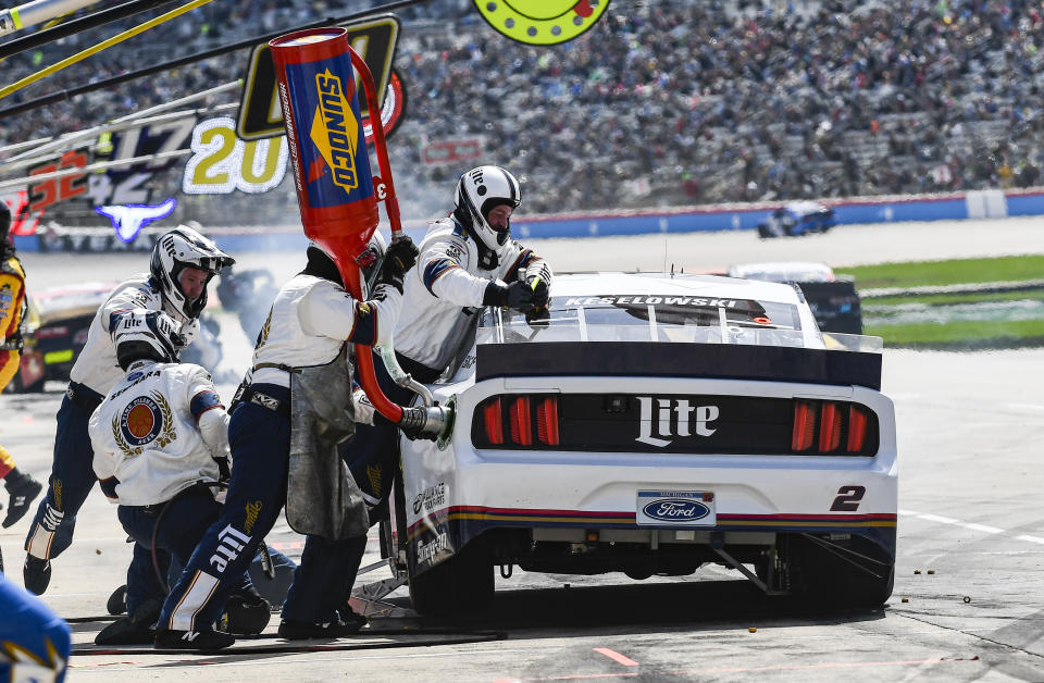 Driver Brad Keselowski's pit crew service his car during a NASCAR Cup auto race at Texas Motor Speedway, Sunday, March 31, 2019, in Fort Worth, Texas. (AP Photo/Randy Holt)