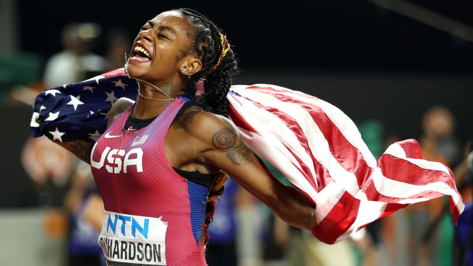 Richardson celebrates with the flag after being crowned world champion. - Patrick Smith/Getty Images
