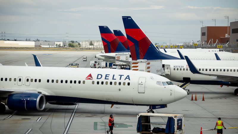 A Delta jet approaches its gate at the Salt Lake City International Airport in Salt Lake City on Tuesday, Aug. 2, 2022. 
