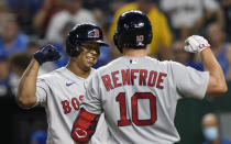 Boston Red Sox's Rafael Devers, left, is congratulated by teammate Hunter Renfroe after hitting a home run during the eighth inning of a baseball game against the Kansas City Royals in Kansas City, Mo., Friday, June 18, 2021. (AP Photo/Reed Hoffmann)