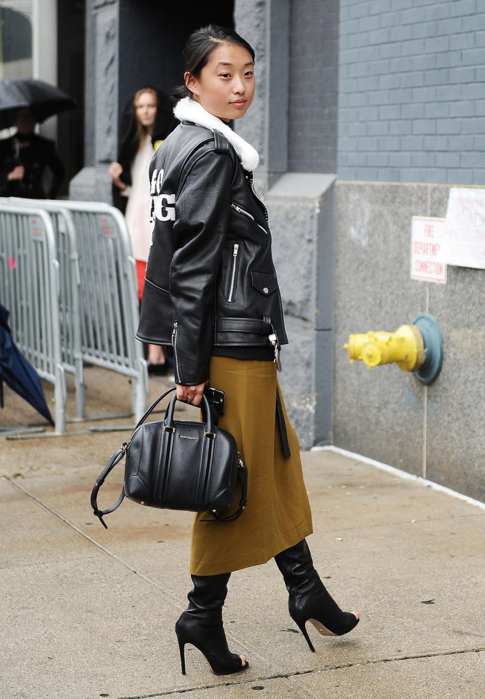 An outfit consisting of wool, leather and black boots at New York Fashion Week.