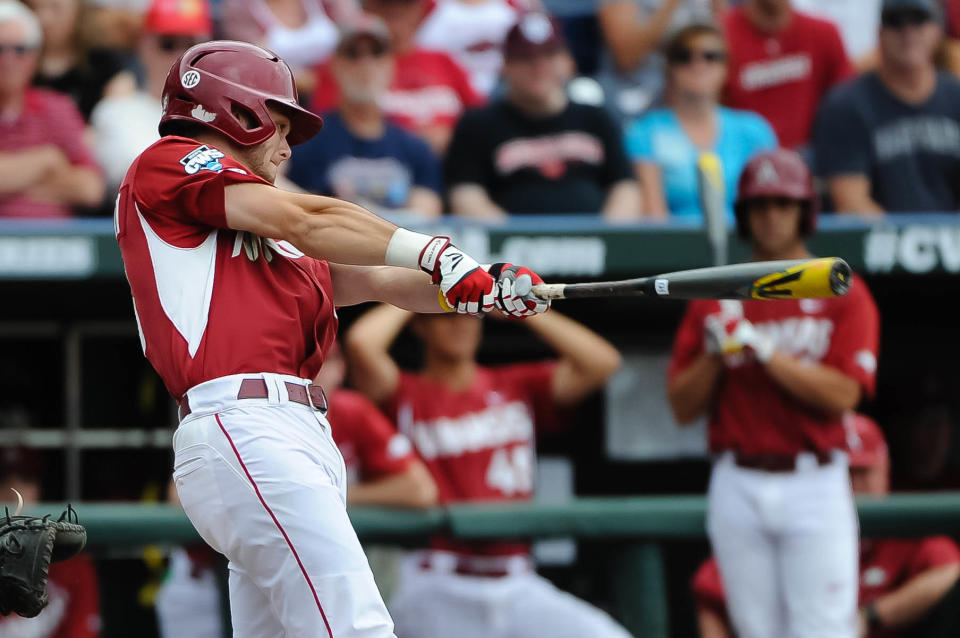 Jun 13, 2015; Omaha, NE, USA; Arkansas Razorbacks outfielder Andrew Benintendi (16) hits a sacrifice RBI against the <a class="link " href="https://sports.yahoo.com/ncaaw/teams/virginia/" data-i13n="sec:content-canvas;subsec:anchor_text;elm:context_link" data-ylk="slk:Virginia Cavaliers;sec:content-canvas;subsec:anchor_text;elm:context_link;itc:0">Virginia Cavaliers</a> in the third inning in the 2015 College World Series at TD Ameritrade Park. Mandatory Credit: Steven Branscombe-USA TODAY Sports