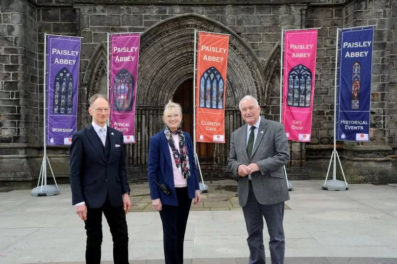 Depute session clerk David Davidson, Manager Linda Barrett and Rev Jim Gibson in front of new banners unveiled at the Abbey
