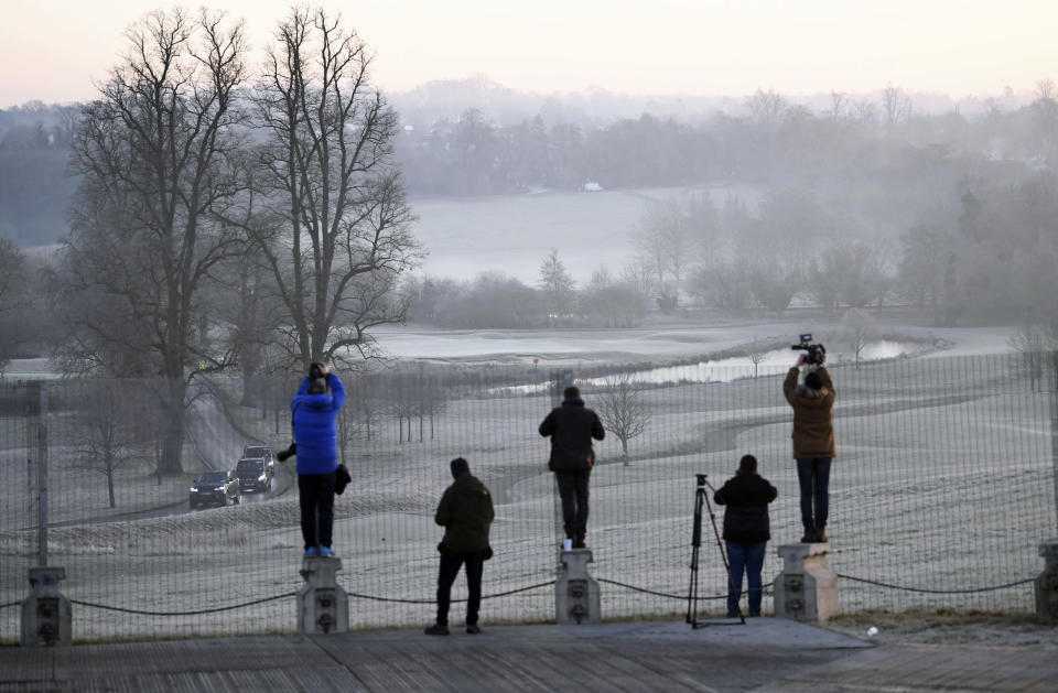 Photographers record the arrival of a motorcade at The Grove hotel where Nato leaders are attending their annual summit, in Watford, England, Wednesday, Dec. 4, 2019. (Stefan Rousseau/PA via AP)