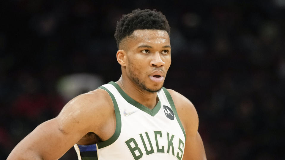 Milwaukee Bucks forward Giannis Antetokounmpo looks on during the second half of an NBA basketball game against the Houston Rockets, Friday, Dec. 10, 2021, in Houston. (AP Photo/Eric Christian Smith)