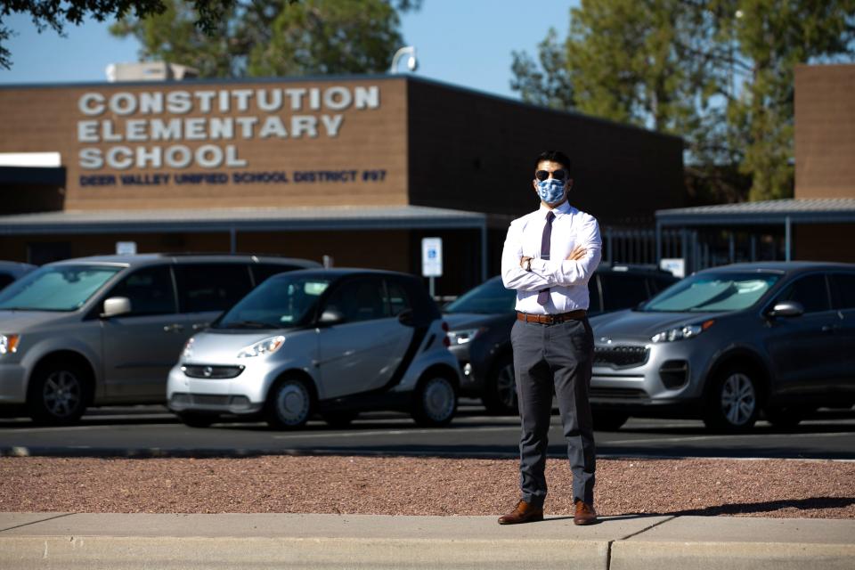 Ruben Miranda, a music and band teacher at Constitution Elementary School, part of the Deer Valley Unified School District, in Phoenix, resigned last week because of COVID-19 concerns just before students returned to the school in person. Miranda who had taught at the school for six years is seen in front of the school on October 1, 2020.  