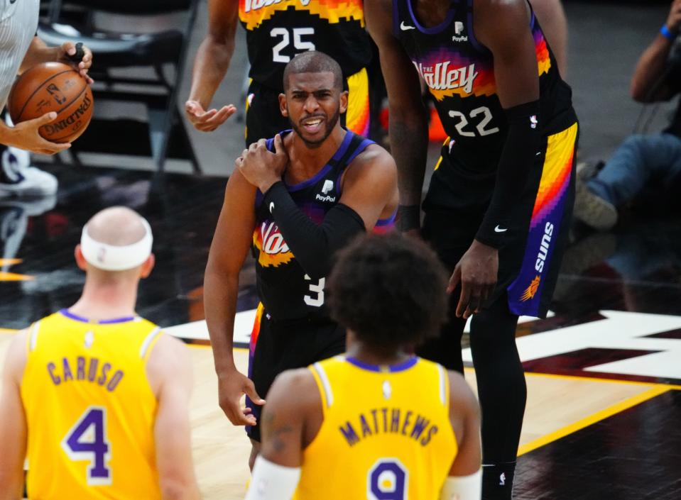 Suns guard Chris Paul reacts after suffering an injury during Game 5 against the Lakers.