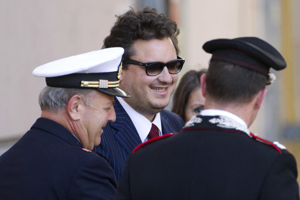 Prosecutor Stefano Pizza, center, arrives for the preliminary, closed-door hearing for the 2012 grounding off Tuscany that killed 32 people, in Grosseto, Italy, Monday, April 15, 2013. An Italian court is mulling whether to hand down indictments against the captain and some crew of the Costa Concordia cruise ship for the 2012 grounding off Tuscany that killed 32 people. Prosecutors want Capt. Francesco Schettino to stand trial for alleged manslaughter, causing a shipwreck and abandoning the ship before all passengers had been evacuated. They want four other crew members and a Costa manager to face charges of having botched the emergency Schettino attended the preliminary, closed-door hearing Monday in the Tuscan city of Grosseto; the timing of a decision was unknown. (AP Photo/Andrew Medichini)