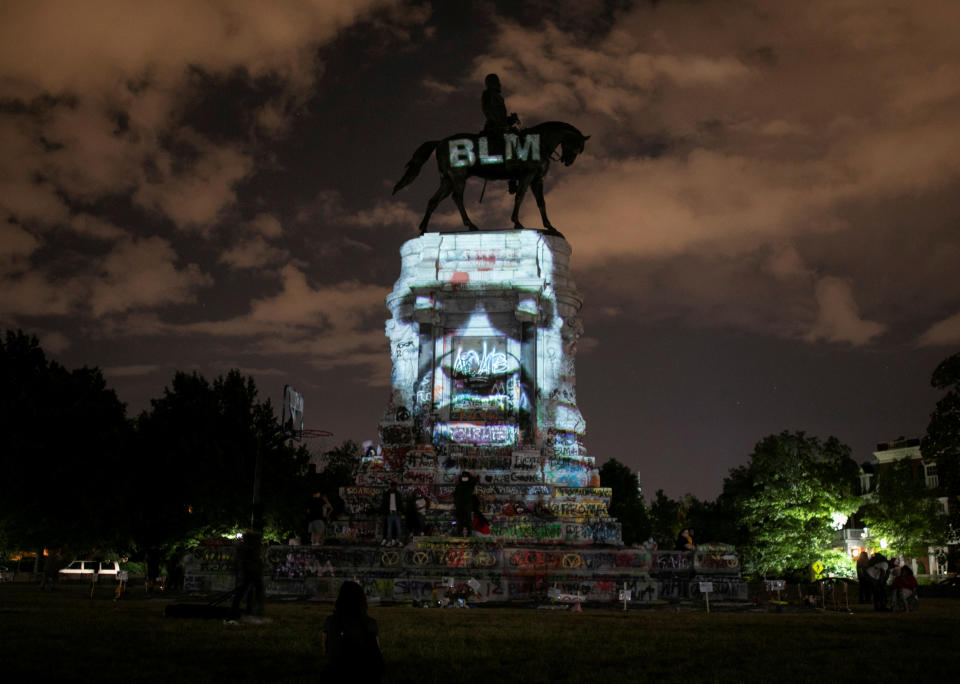 SENSITIVE MATERIAL. THIS IMAGE MAY OFFEND OR DISTURB Artist Dustin Klein projects an image of George Floyd onto the statue of Confederate General Robert E. Lee in Richmond, Virginia, U.S. June 18, 2020. REUTERS/Julia Rendleman     TPX IMAGES OF THE DAY