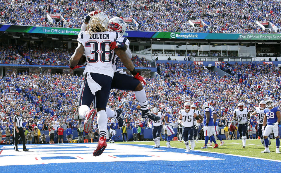 New England Patriots running back Brandon Bolden celebrates his touchdown run against the Buffalo Bills with James White, rear, in the first half of an NFL football game, Sunday, Sept. 29, 2019, in Orchard Park, N.Y. (AP Photo/Ron Schwane)