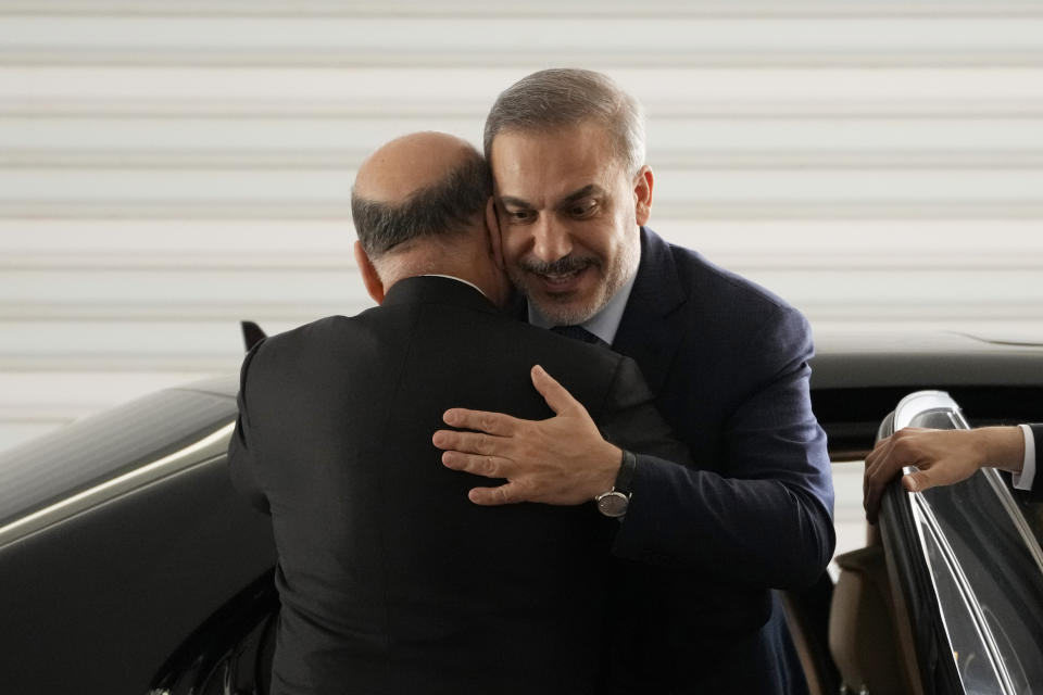 Iraqi Foreign Minister Fouad Hussein, left, receives Turkish Foreign Affairs Minister Hakan Fidan, right, in Baghdad, Iraq, Thursday, March 14, 2024. (AP Photo/Hadi Mizban)