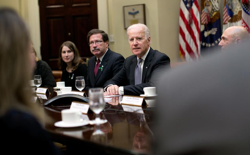 Then-U.S. Vice President Joe Biden leads a meeting on extending access to mental health care at the White House with Katy and Bill Sherlach on Dec. 10, 2013, in Washington, D.C.