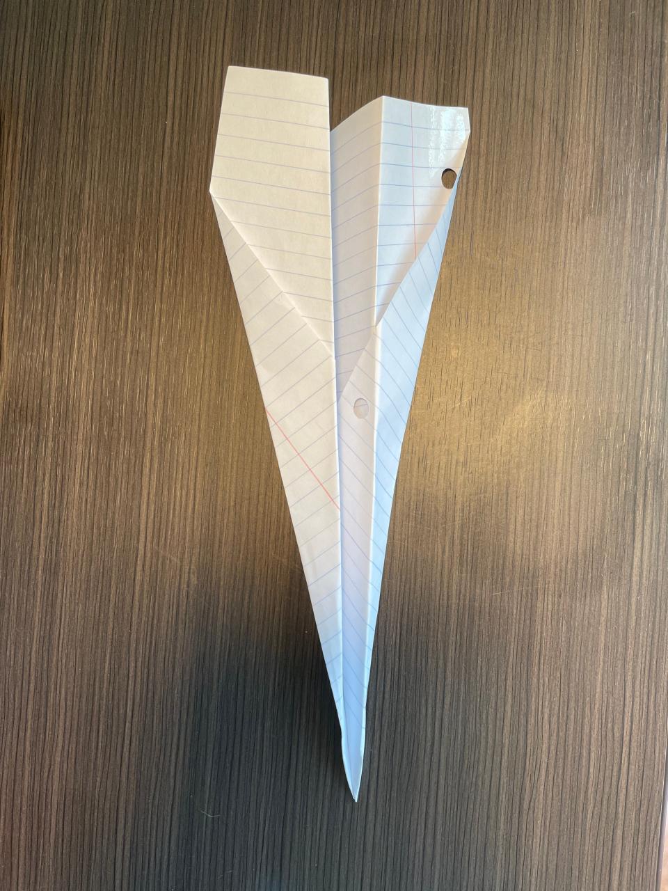 How to make a paper airplane step five