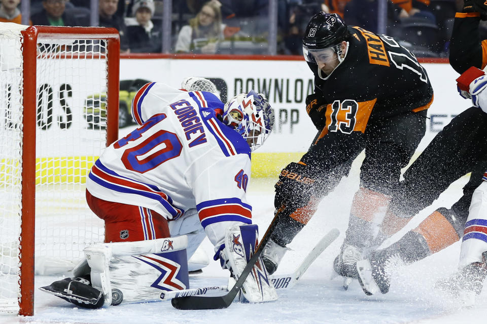 Philadelphia Flyers' Kevin Hayes (13) cannot get a shot past New York Rangers' Alexandar Georgiev (40) during the second period of an NHL hockey game, Friday, Feb. 28, 2020, in Philadelphia. (AP Photo/Matt Slocum)
