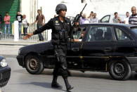 A Tunisian anti-terrorism brigade officer is seen after a shooting at the Bouchoucha military base in Tunis, Tunisia May 25, 2015. REUTERS/Anis Mili