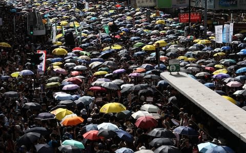 Anti-extradition bill protesters take part in a rally in Hong Kong, China, 21 July 2019. The organizer of the march, the Civil Human Rights Front, is urging the government to set up an independent commission of inquiry to be led by a judge - Credit: Rex