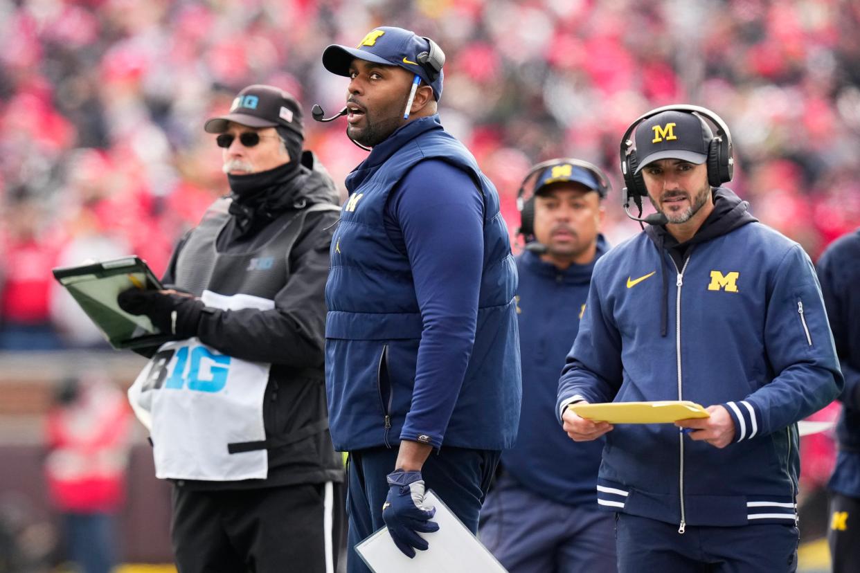 Michigan interim head coach Sherrone Moore watches from the sideline during the first half of Saturday's game against Ohio State.