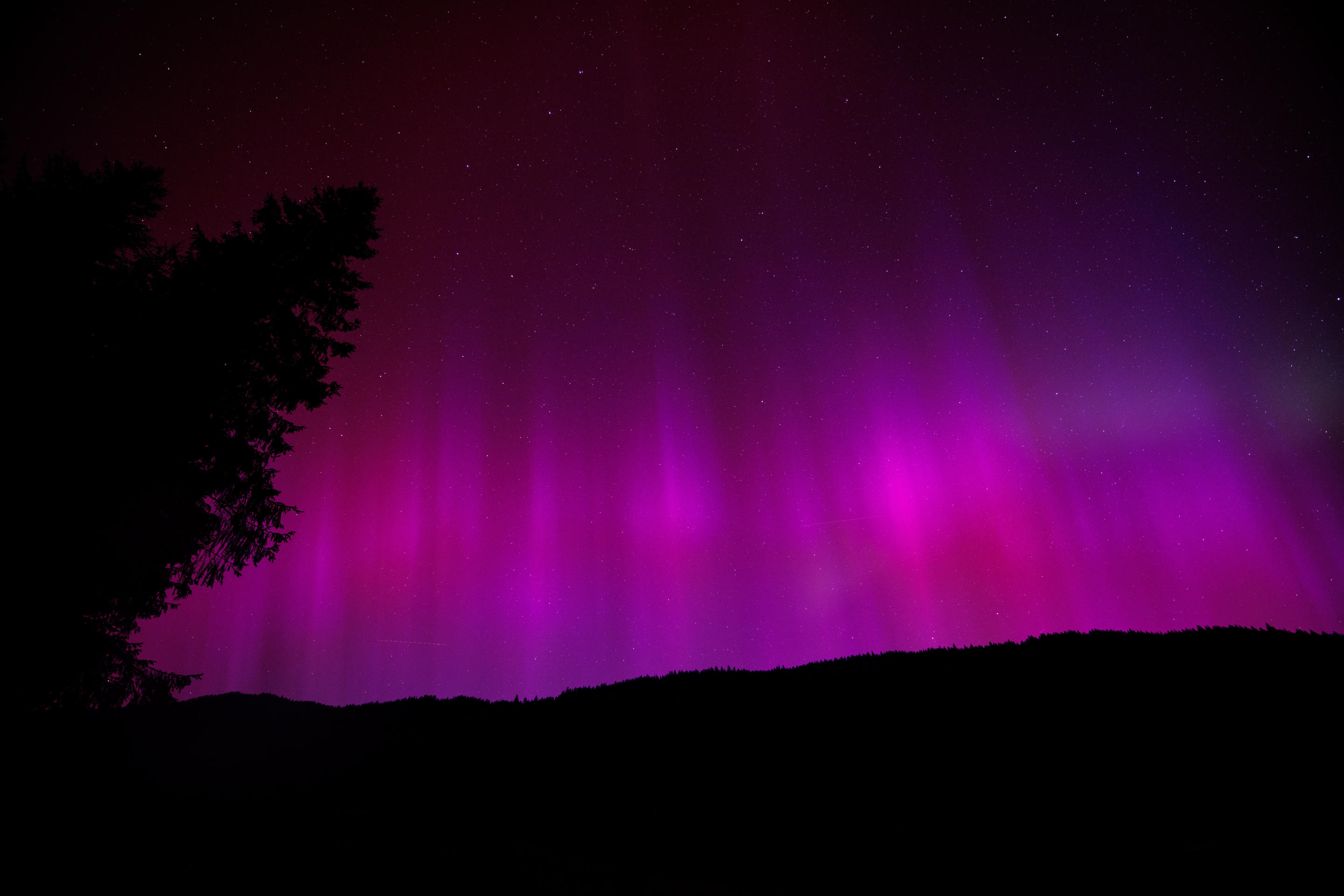 11 May 2024, Bavaria, Krün: Northern lights (aurora borealis) shine in the night sky above Lake Wagenbrüchsee. Photo: Matthias Balk/dpa (Photo by Matthias Balk/picture alliance via Getty Images)