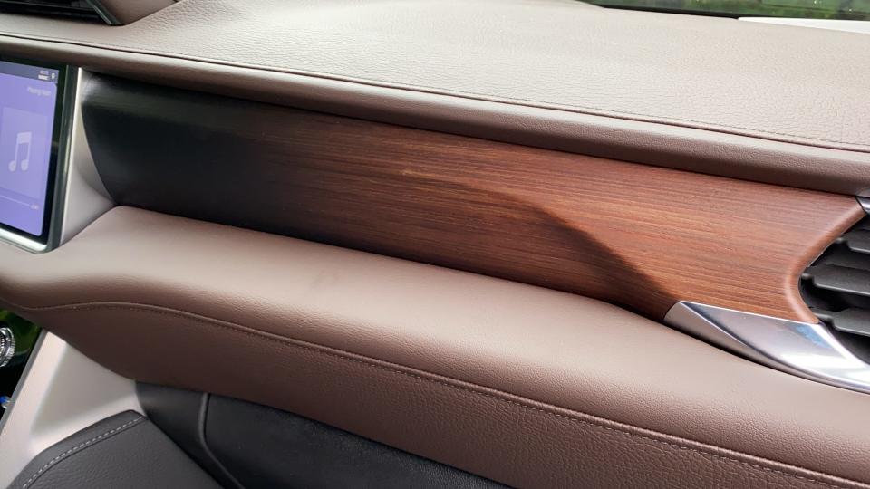 The 2021 GMC Yukon Denali has hand-sprayed wood trim with grain you can feel.