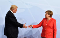 <p>German Chancellor Angela Merkel, right, greets President Donald Trump at the start of the G-20 meeting in Hamburg, northern Germany, on Friday, July 7, 2017. (Photo: John MacDougall/Pool Photo via AP) </p>