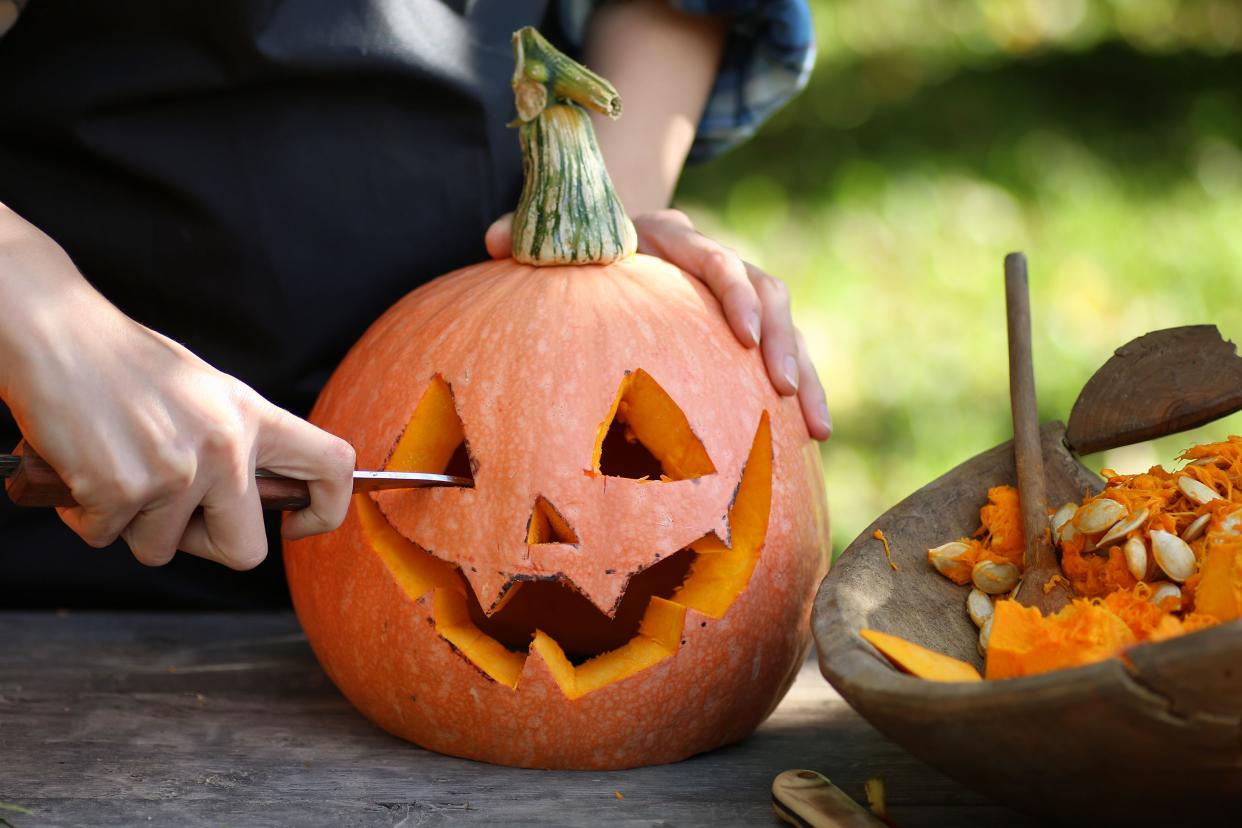 Head carved from pumpkin and monster on holiday