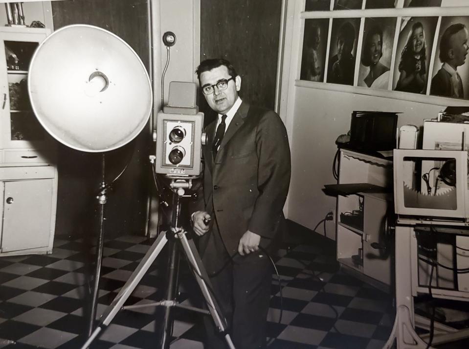 This undated photo shows Ray Patnaude Sr. in his photography studio at McDonald Studio in South Bend. Patnaude will turn 100 on Aug. 9. 2023.