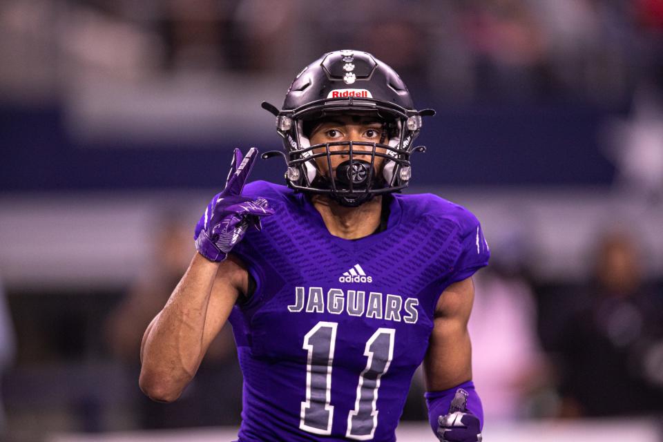 LBJ senior receiver Noah Baker, celebrating a touchdown against Stephenville in the Class 4A Division I state championship game last December, grew up playing football with many of his LBJ teammates.