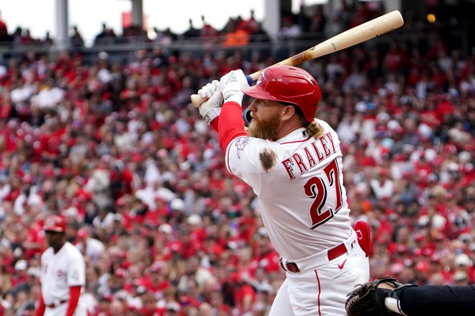 Cincinnati Reds left fielder Jake Fraley (27) hits a double in the sixth inning during a baseball game against the Cleveland Guardians, Tuesday, April 12, 2022, at Great American Ball Park in Cincinnati, Ohio. 