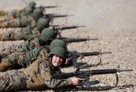 Sabera, 23, a soldier from the Afghan National Army (ANA) gestures during a shooting exercise at the Kabul Military Training Centre (KMTC) in Kabul, Afghanistan October 26, 2016. REUTERS/Mohammad Ismail