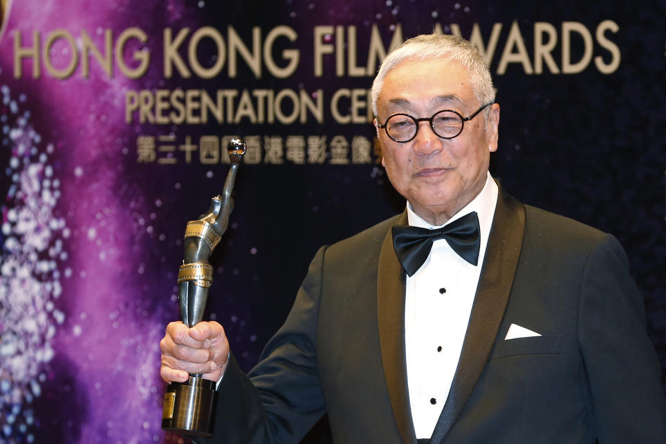 FILE -Hong Kong actor Kenneth Tsang poses after winning the Best Supporting Actor award for his movie "Overhead 3" during the Hong Kong Film Awards in Hong Kong Sunday, April 19, 2015. Hong Kong media reported that Tsang was found dead Wednesday in his quarantine hotel room after arriving from Singapore. (AP Photo/Kin Cheung, File)