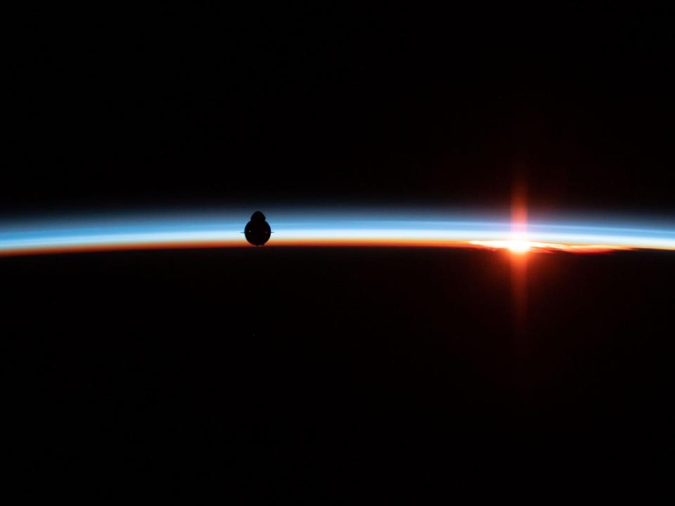 spacex crew dragon spaceship capsule silhouette orbital sunrise dawn commercial crew program nasa astronaut anne mcclain space station 46578276604_7825e367ed_o