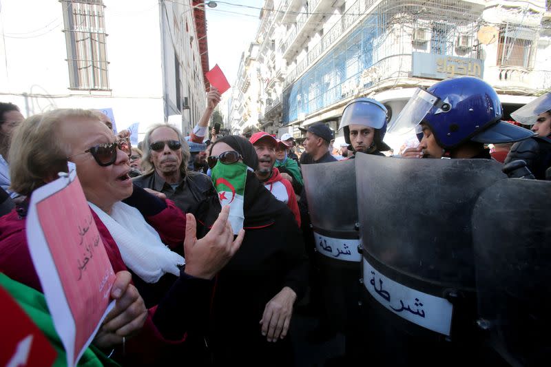 Demonstrators shout slogans during a protest calling to reject the upcoming presidential election in Algiers