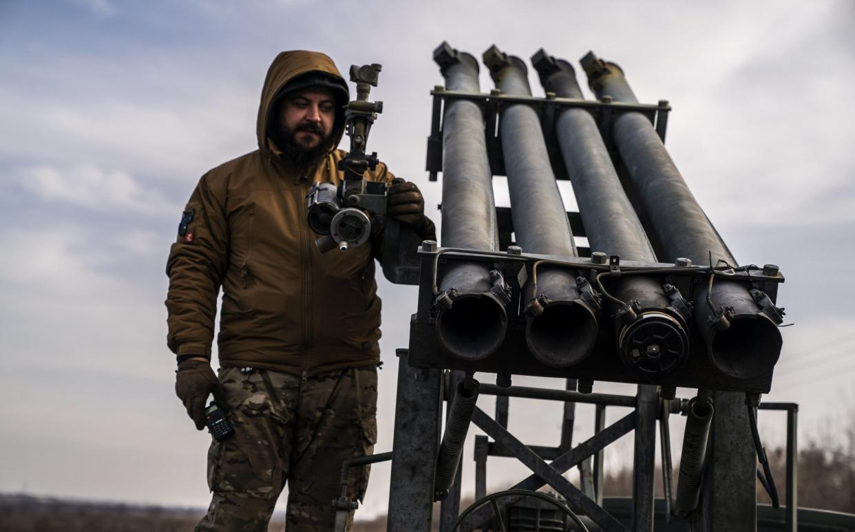 Ukrainian soldiers prepare to fire missiles from a Grad PC3B, with a homemade shuttle, at Russian positions in the direction of Bakhmut