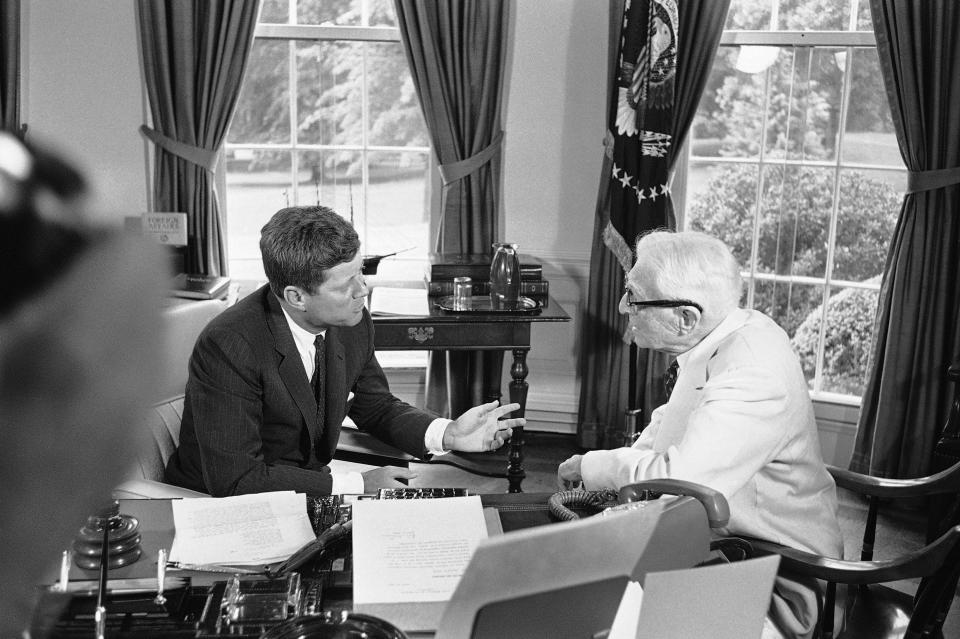 President John Kennedy confers with Bernard Baruch, 90-year-old New York financier, at the White House in Washington on July 26, 1961.