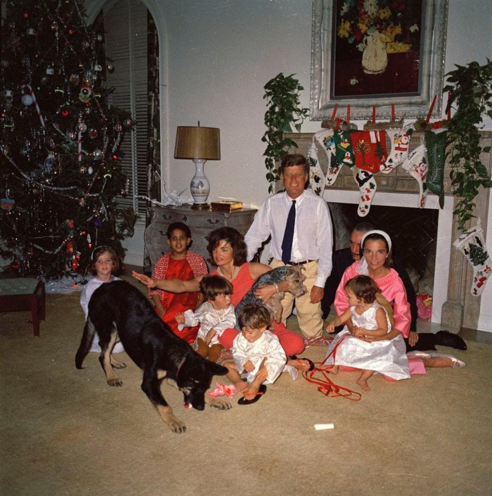 The Kennedys sit on the floor with gifts on Christmas in 1962 in Palm Beach, Florida.