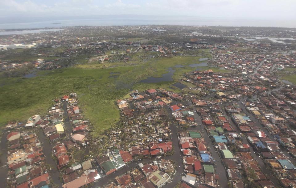 An aerial view shows damages caused by Typhoon Haiyan in the province of Leyte, central Philippines November 10, 2013. One of the most powerful storms ever recorded killed at least 10,000 people in the central Philippines, a senior police official said on Sunday, with huge waves sweeping away coastal villages and devastating one of the main cities in the region. REUTERS/Ryan Lim/Malacanang Photo Bureau/Handout via Reuters (PHILIPPINES - Tags: DISASTER ENVIRONMENT) ATTENTION EDITORS - THIS IMAGE WAS PROVIDED BY A THIRD PARTY. FOR EDITORIAL USE ONLY. NOT FOR SALE FOR MARKETING OR ADVERTISING CAMPAIGNS. NO SALES. NO ARCHIVES. THIS PICTURE IS DISTRIBUTED EXACTLY AS RECEIVED BY REUTERS, AS A SERVICE TO CLIENTS