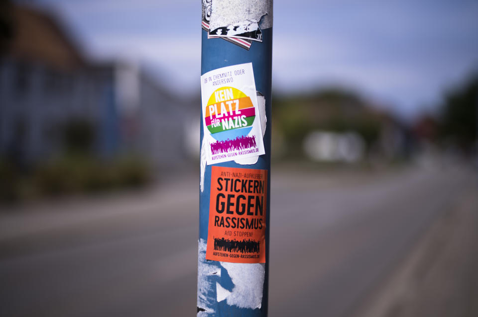A sticker against Nazis and racism is displayed on a lamp pole near the Mina Witkojc school in Burg (Spreewald), Germany, Wednesday, July 19, 2023. The stickers read: "Whether in Chemnitz or elsewhere - No Place for Nazis - Stand up against Racism." (AP Photo/Markus Schreiber)