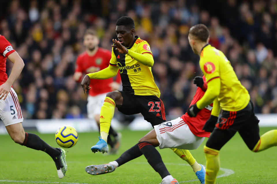 WATFORD, ENGLAND - DECEMBER 22: Ismaila Sarr of Watford is fouled in the area by Aaron Wan-Bissaka of Manchester United which lead to a penalty for Watford during the Premier League match between Watford FC and Manchester United at Vicarage Road on December 22, 2019 in Watford, United Kingdom. (Photo by Richard Heathcote/Getty Images)