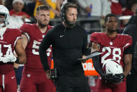 Arizona Cardinals head coach Kliff Kingsbury watches play against the Tampa Bay Buccaneers during the first half of an NFL football game, Sunday, Dec. 25, 2022, in Glendale, Ariz. (AP Photo/Rick Scuteri)
