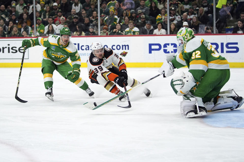 Minnesota Wild right wing Mats Zuccarello, left, and goaltender Filip Gustavsson (32) defend against Anaheim Ducks center Sam Carrick (39) during the second period of an NHL hockey game Saturday, Jan. 27, 2024, in St. Paul, Minn. (AP Photo/Abbie Parr)